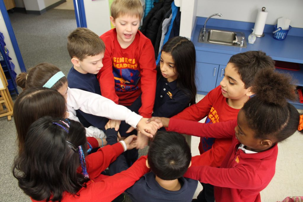 Elementary students untying a human knot in team-building exercise
