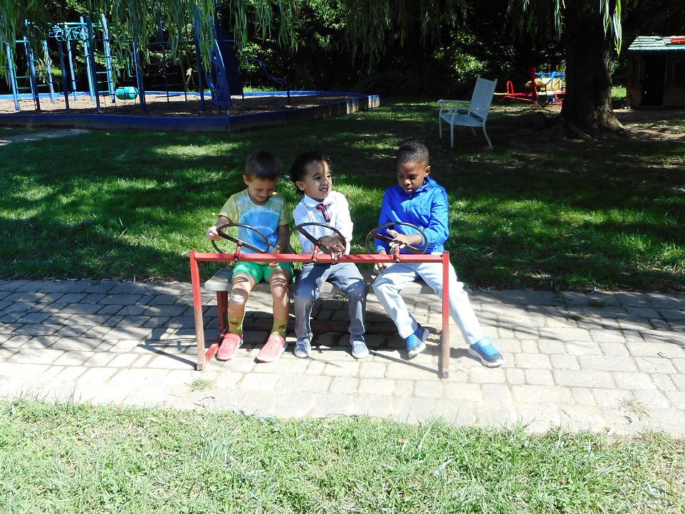 Preschool students playing on the playground