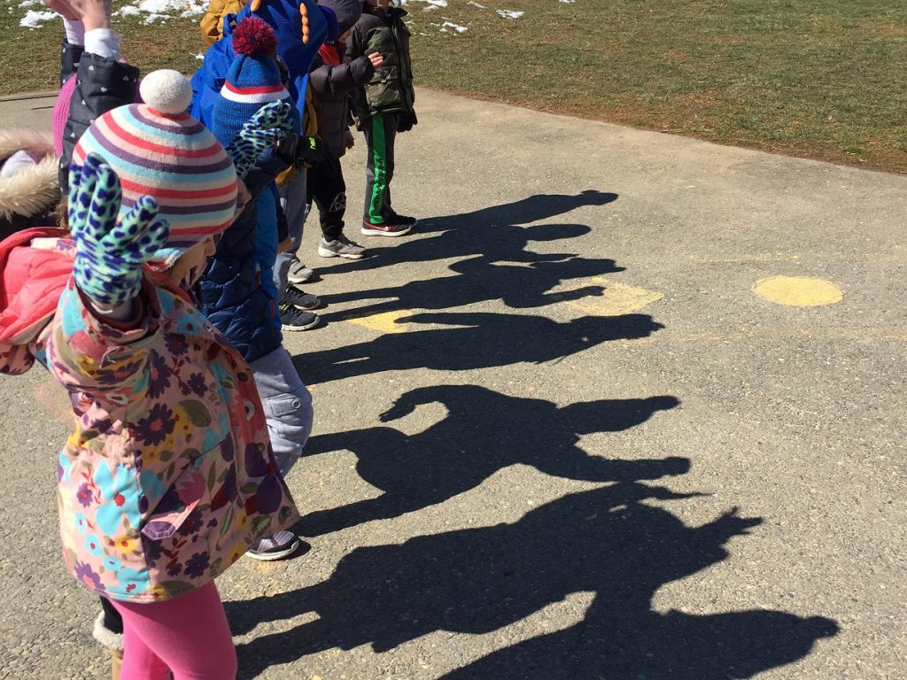 Preschool students observing their shadows