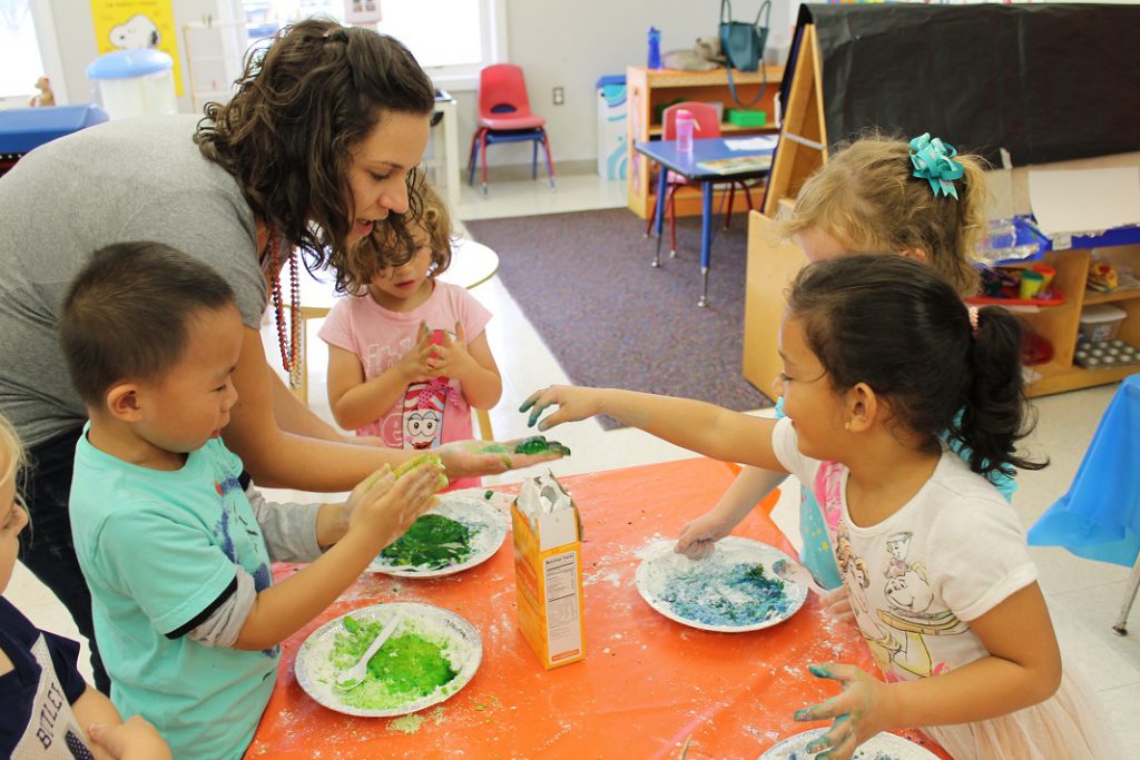 Preschool students making slime in after-school science club