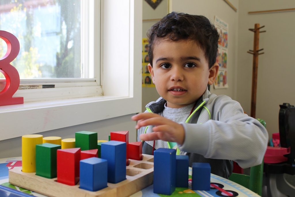 Preschooler doing puzzles