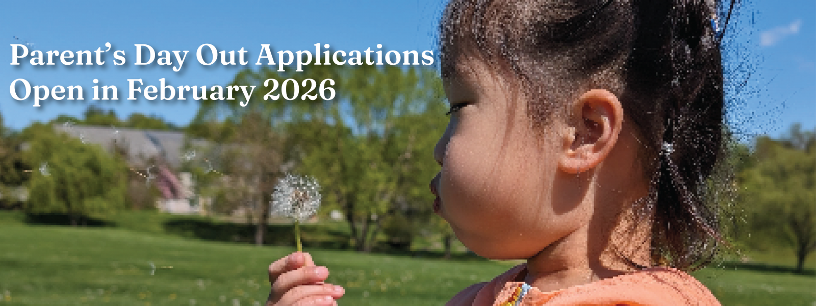 two happy elementary friends bundled up against the cold while they throw snow into the air